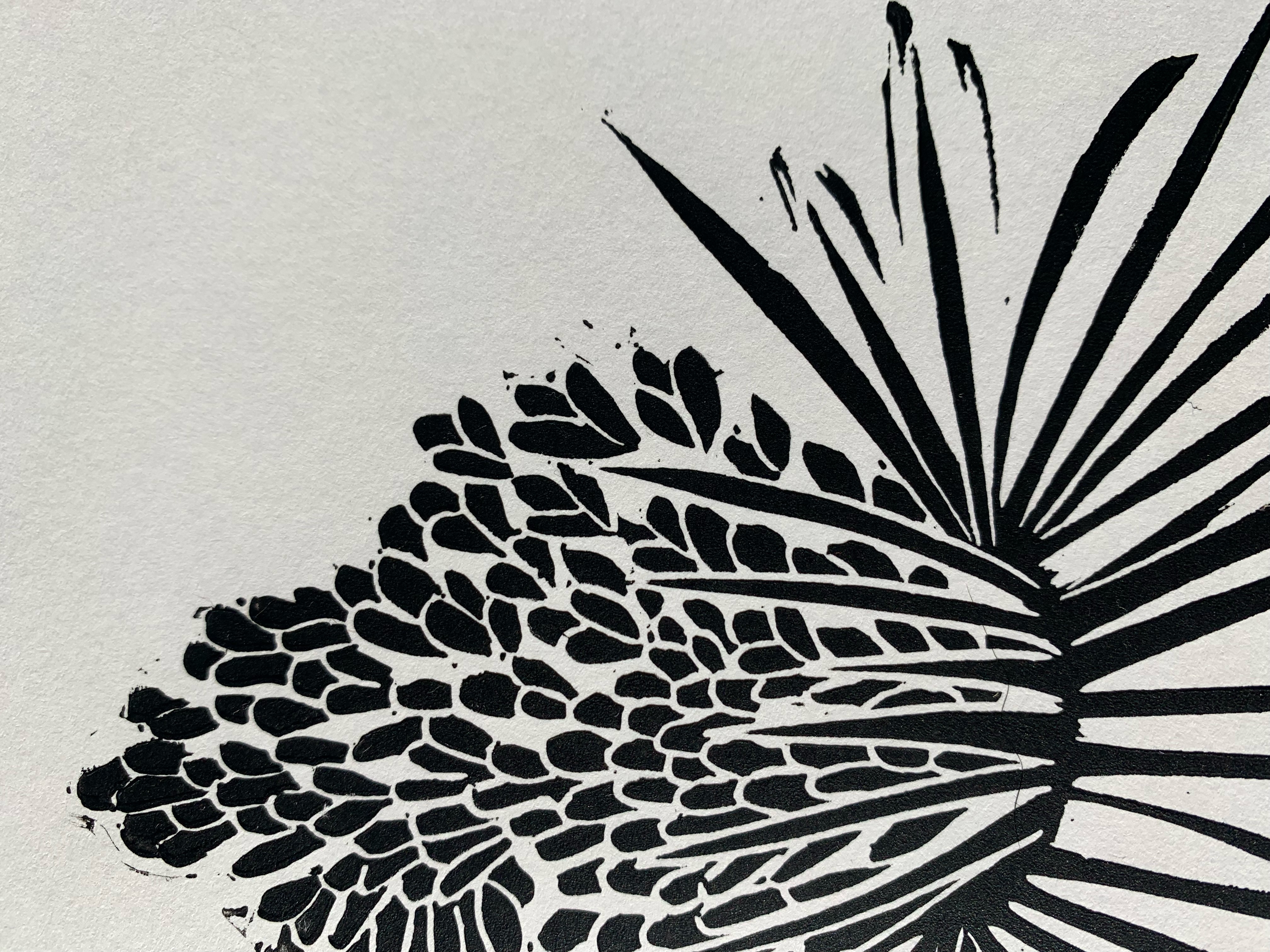 Detailed view of block print of Yucca on white paper in black ink.